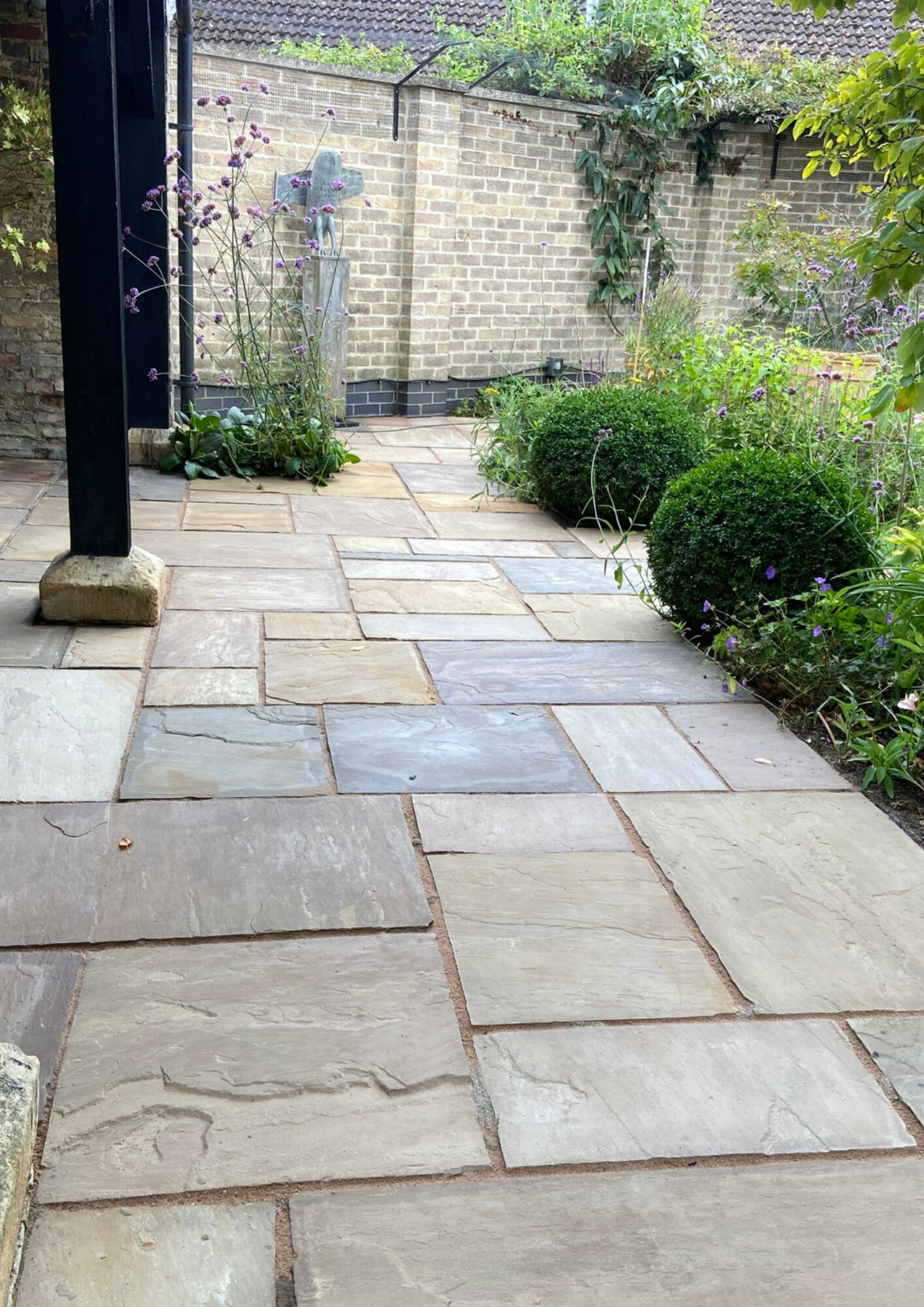 What's the best way to clean an Indian sandstone patio?