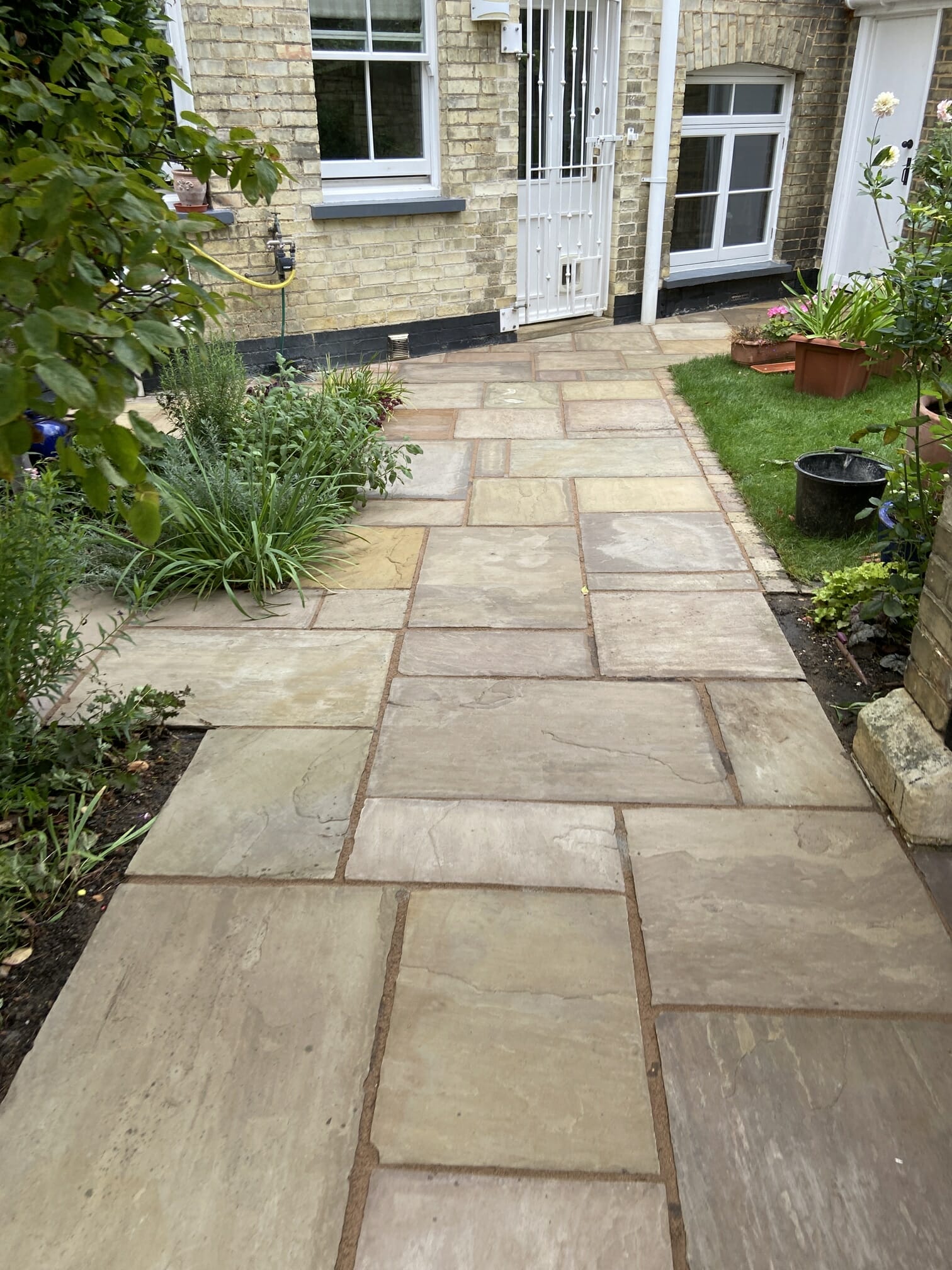 What's the best way to clean an Indian sandstone patio?